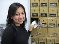 Woman standing in front of her private mailbox