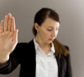 Woman In Business Suit Showing Her Palm, Body Language, Say No A
