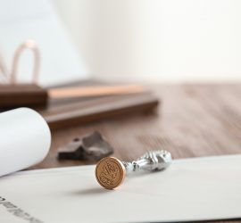 Vintage Notary Stamp And Documents On Wooden Table, Closeup. Spa